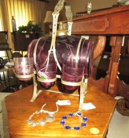 Antique purple colored glass barrel decanter w 3 glasses and stand. Missing 3 glasses, however beautiful!
