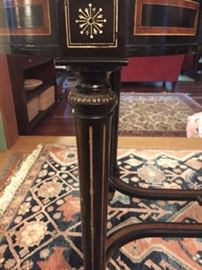 detail of antique kidney-shaped table leg