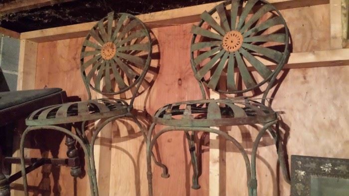 4 chairs and a table in this neat iron patio seat.  Chairs need a little attention.