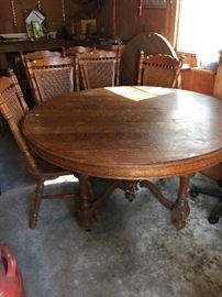 Old oak table on wheels with 6 chairs