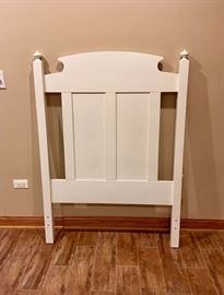 Two White Headboards and a Three Drawer Side Table