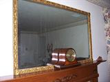 Antique wood framed mirror, mantle clock