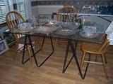 Glass topped table with metal base
Four Oak dining chairs with 5-spoke back
Silver plate trays
Leaded Crystal
Vintage boudoir mirrors