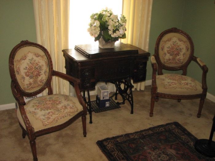 hand carved arm chairs with embroidered upholstery, vintage sewing machine