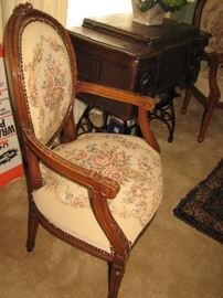 hand carved arm chairs with embroidered upholstery, vintage sewing machine