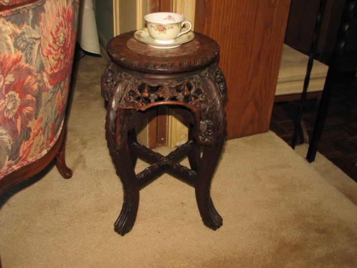 carved plant stand
