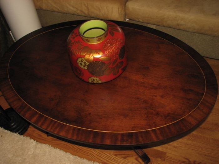 round walnut coffee table with inlays