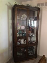 Lighted Curio Cabinet. It lights on both top and bottom  