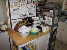 Kitchen if full of Pyrex, Vision ware, Corning, cutlery, dish sets , Cuisinart , Kitchen aid and the list goes on! Again, Many NEW IN BOX items. One room is full of nothing but new cookware.