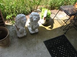 Concrete yard art, lions and goose