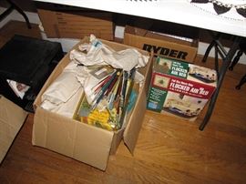 Lots of art supplies, paint brush and accessories.