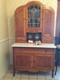 Lovely kitchen center cabinet with enamel counter, shown closed