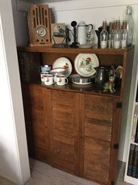 Narrow shutter door cabinet with shelves, fun enamel holiday set, old tile radio, etc.