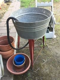 Old wash bin tub with red legs