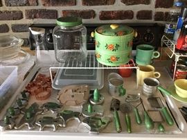 Green wood handled kitchen cutters and utensils