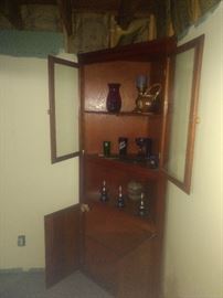 corner cabinet and glassware