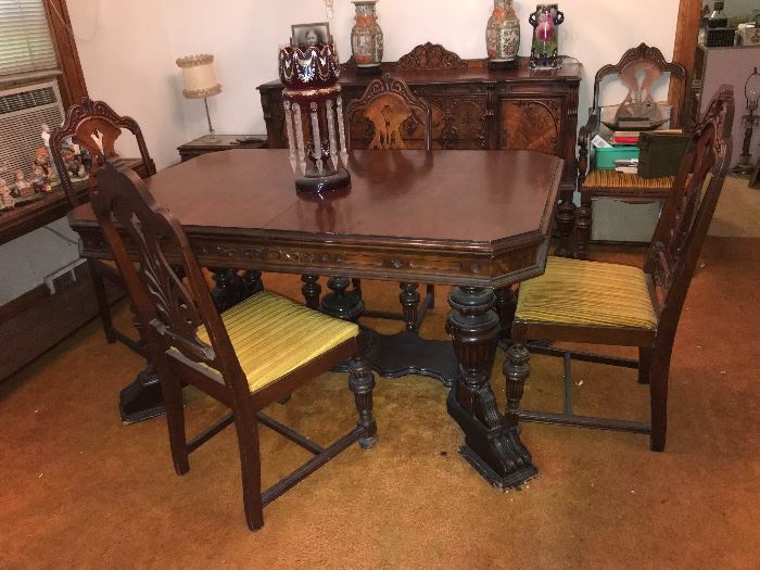 Antique dining room table and chairs in perfect condition! Matches buffet cabinet
