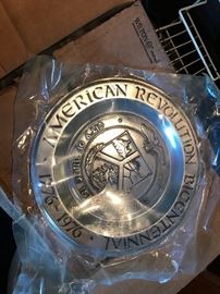 Cases full of Bicentennial pewter plates