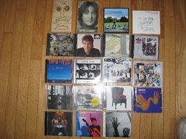 Two John Lennon paperback books and Beatles CD's