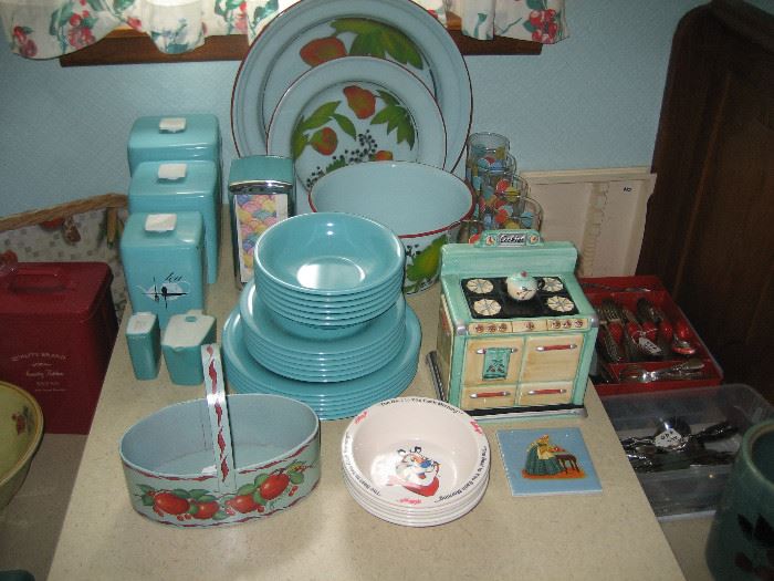 Vintage turquoise kitchenware, cookie jar, and canisters