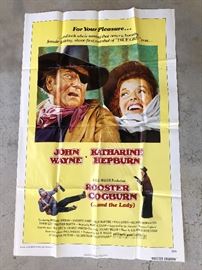 Rooster Cogburn( John Wayne, Katharine Hepburn)1 of the 36 Vintage Posters Available at this sale!! They are from the Victoria Theater on Caroline Street in Fredericksburg,Va. They were mailed to the theater ,to be displayed in the marquee. They were usually thrown away ,but a family member worked there & saved them!