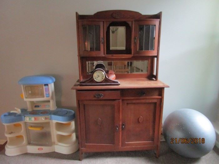 Antique cabinet with beveled glass windows