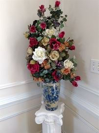 The vase and flowers are very pretty!