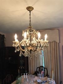 1950’s Tiered crystal chandelier. All the lighting in the house is for sale. Large collection of chandeliers