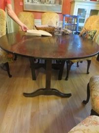 Antique oval wood dining table and chairs