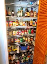 Well stocked pantry full of non expired canned and bottled foods