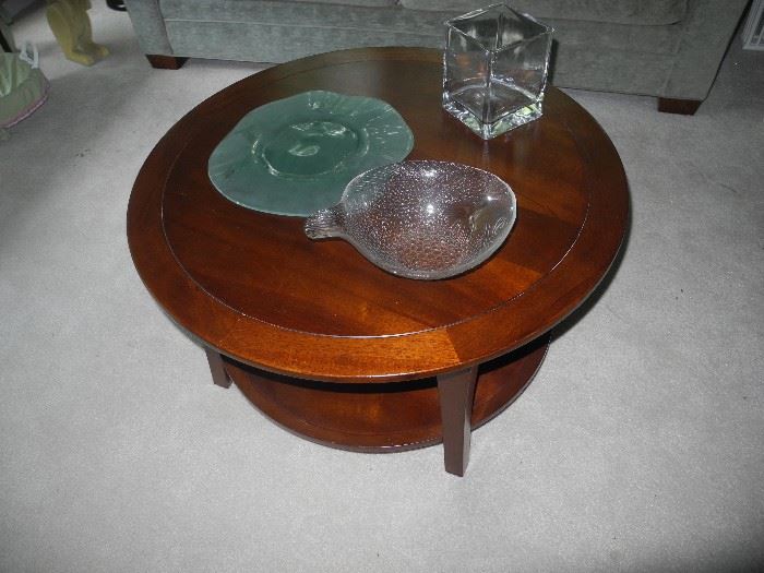 Lovely round coffee table with shelf underneath