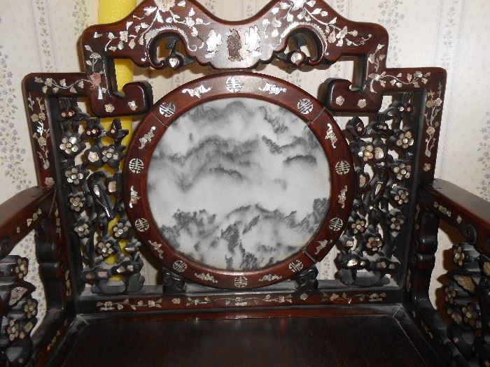 Marble circle insert - mountain scene with gorgeous carved floral climbing accents, towering on both sides.