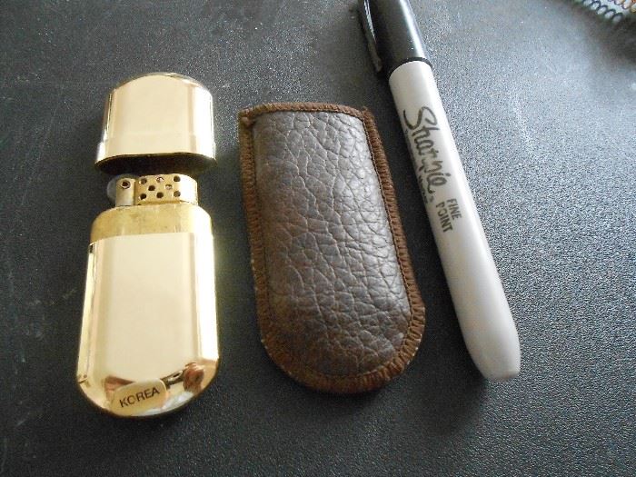 Small lighter with leather pouch
