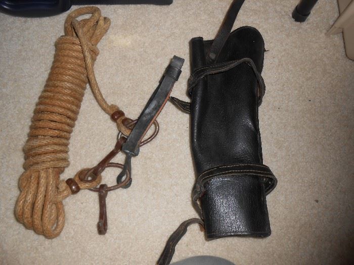 Shotgun holder for a saddle and rope