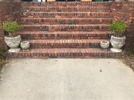 Lot 109: Four Greek Key Concrete Planters