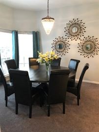 Love this dark wood table with 8 chairs