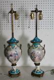 Pair of Sevres porcelain vases and covers with bronze mounts, white ground scenic cartouches on celeste blue. H: 28 3/4"