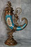 Sevres style porcelain and figural bronze-mountedcornucopia vase and cover. 22"