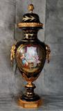 Monumental Sevres porcelain vase and cover with gilt-bronze mounts, cobalt blue ground with signed scenic reserve. H: 37 1/2"