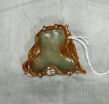 Chinese carved celadon and russet jade leaf form brush washer in a bronze frame on carved carnelian feet. 2 1/4" x 2 1/2"