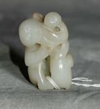 Chinese carved white jade figural group. 2"