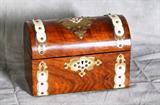 Fine English Victorian rosewood tea caddy with brass and ivory bindings, the interior with two compartments. H: 7" W: 10 1/8" D: 5 3/4"