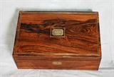 Fine English George III period rosewood lap desk with brass inlaid stringing opening to an interior with tooled and gilt leather writing surface. H: 5 1/2" W: 15" D: 9 3/4"