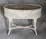 American painted wicker planter. H: 28" W: 30" D:14"