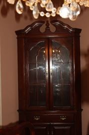 American Drew lighted corner cupboard.