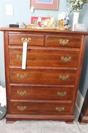 Six drawer chest.  Glass tray and perfume on top.