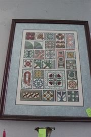 Cross-stitch done by Ms. Johnson.  There are many beautiful pieces throughout the house.  This one is of quilting motifs.