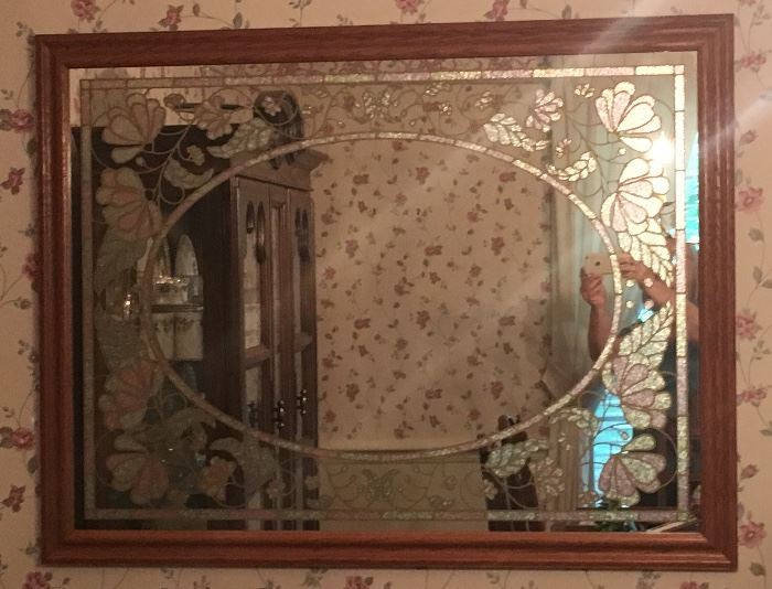 Large decorative mirror with frosted glass design.