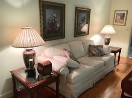 Traditional living room furniture--lovely white sofa by Highland House, beveled glass and wood end tables and coffee table.