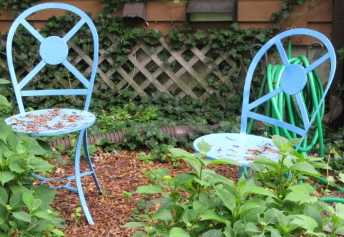 Two blue metal chairs